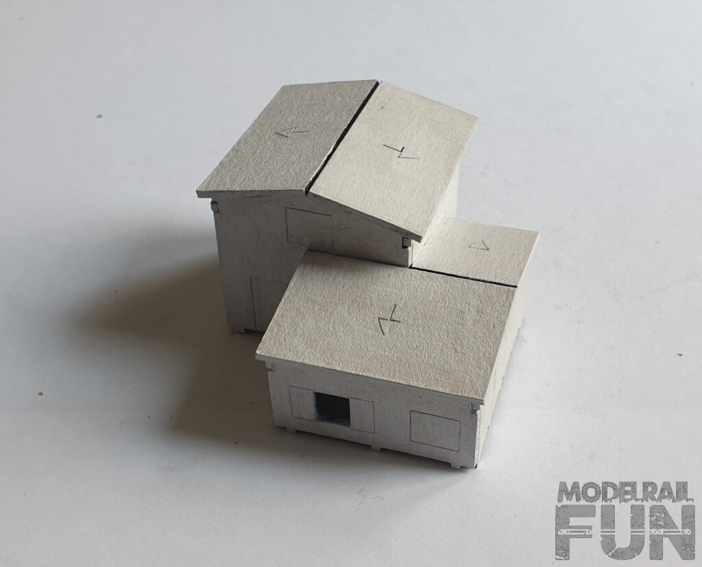 Caserío de cartón cortado.Imprimacion