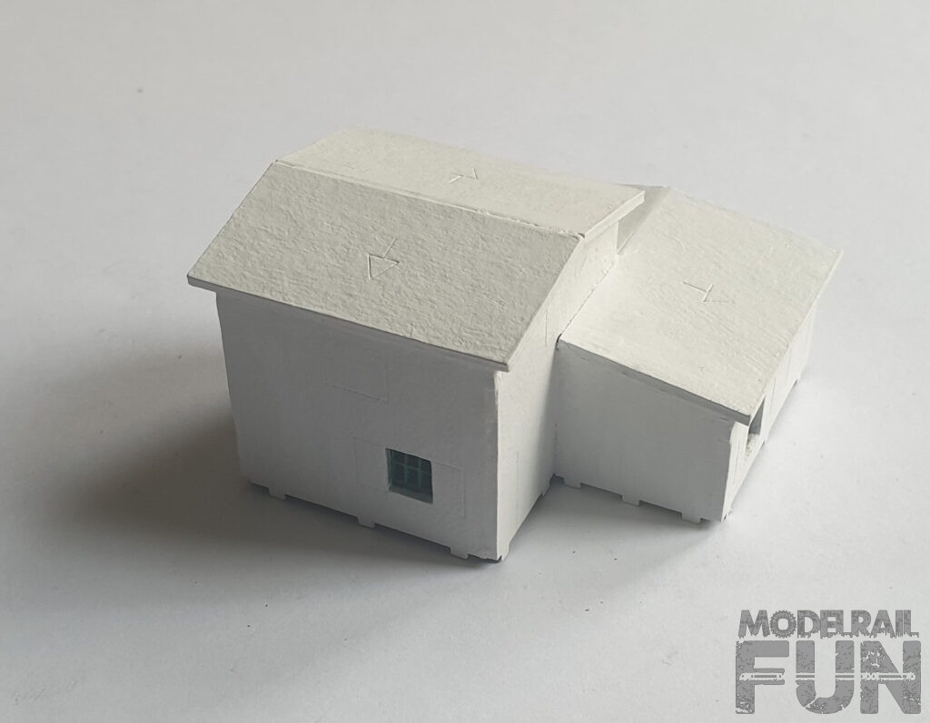 Caserío de cartón cortado.Pintado